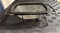 Side view showing mesh basket, frame, folding legs