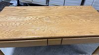 Top view showing oak grain and surface wear