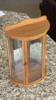 Full view of curved oak display case