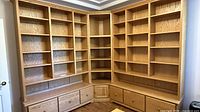 Full L-shaped bookcase showing both wall sections, drawers closed