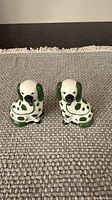 Front view of both ceramic spaniel figurines