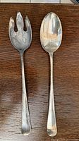Serving fork and spoon fronts
