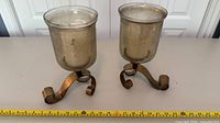 pair of hurricane candle holders front view with tape for scale