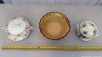 Top view of all three serveware pieces with measuring tape for scale