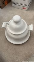 Entire set assembled with lid on and ladle in place