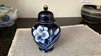 Front view ginger jar showing floral design and lid