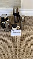 Group shot of all four drinkware items on carpet