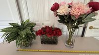 All three arrangements side by side with tape measure for scale