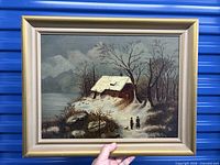 Full view of framed winter landscape painting