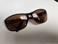 Front angled view of sunglasses showing lens tint and frame shape