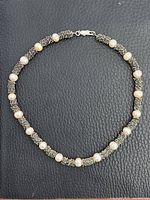 Full view of necklace showing bead pattern and clasp