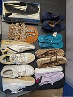 overview of eight pairs shoes on table