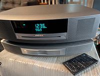 Front view of Wave Music System stacked on 3-CD changer with remote