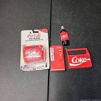 Front view of all four magnets showing sealed musical magnet and three loose magnets