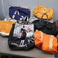 Group shot of all six bags on table