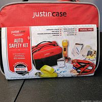 Front view of Justin Case Auto Safety Kit bag with packaging detailing included items