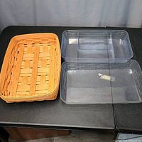 Rectangular basket beside two clear protectors (one divided)