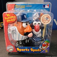 Front of sealed blister package showing Mr. Potato Head Yankees figure and accessories