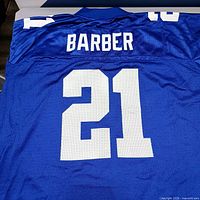 Back view of blue Barber #21 jersey