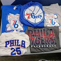 Overview of all five 76ers t-shirts displayed