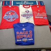 Group shot showing four tees and scarf