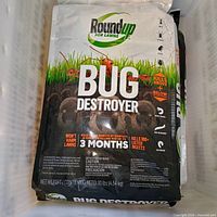 Front of Roundup for Lawns Bug Destroyer bag showing branding, weight and product claims