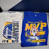 Front view of both T-shirts showing full graphics and colors