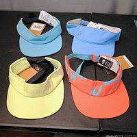 All four visors displayed: light blue, sky blue Puma, pale yellow, coral patterned
