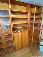Front view of full bookshelf unit showing shelves and lower doors