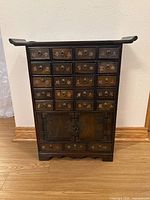 Full front view showing drawers, doors, hardware and overall condition