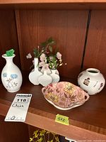 All four china pieces on shelf