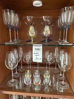 Cabinet view of all glassware on two shelves