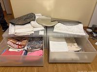 overview of linens in two clear drawers plus placemats and plate on top