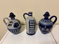 Front view of three salt-glazed stoneware jugs