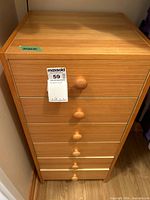 Full view of wooden six-drawer lingerie chest showing knobs and finish