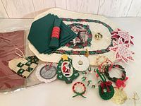 Group view of placemats, napkins with rings, and assorted ornaments