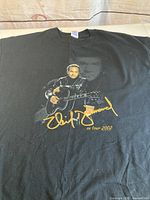 Front view showing Neil Diamond portrait graphic and size tag