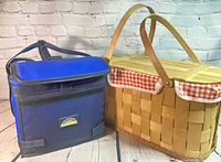 Cooler bag next to woven picnic basket showing relative size and overall appearance