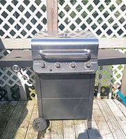 Full view of Char-Broil three-burner grill on deck