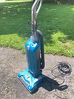 Full view of Hoover WindTunnel 12 upright vacuum, hose, cord visible