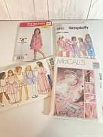Group shot of four pattern envelopes showing covers