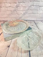 Two crystal pieces on Mikasa box: round plate and divided dish