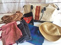 Overview of all seven items: duffel, straw hat, crocheted tote, crossbody pouch, three scarves
