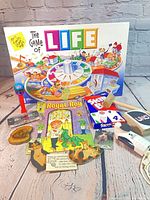Overall lot with board game box, card decks, wooden items, cassette, fan