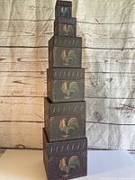 All six rooster design boxes stacked to show graduating sizes