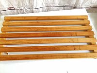 Full view of slatted wood panel with seven slats