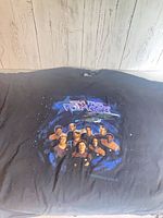 Full view of front of T-shirt showing graphic and overall condition