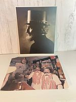 Both prints upright: portrait behind, color bar scene front