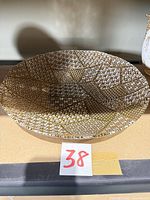 Top view showing gold geometric pattern and diameter