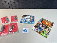 Overview of two bagged figures, French booklet and Star Wars comic